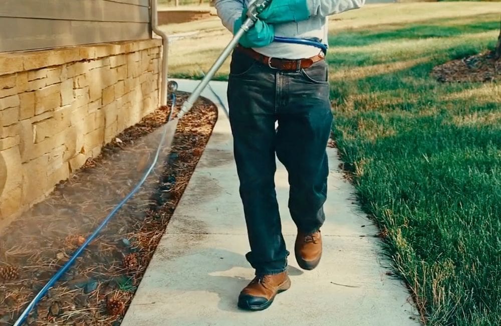 Warne Green Force spraying home for pest control