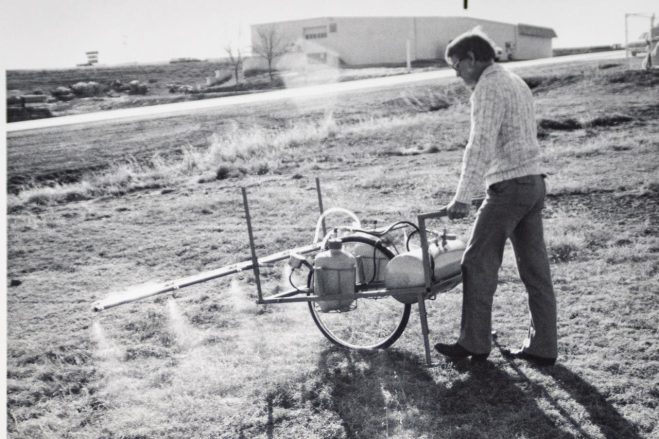 Historic Warne photo of person spraying for weeds Historic Warne photo of person spraying for weeds